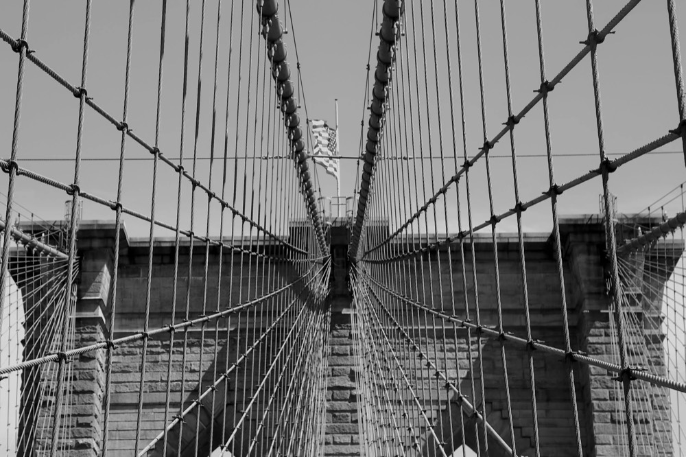 Brooklyn Bridge cables and walkway in black and white